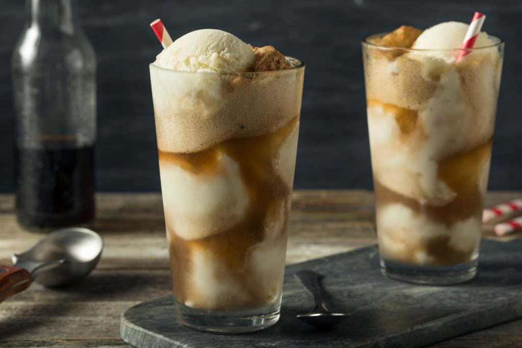 Homemade Soda Black Cow Ice Cream Float with a Straw